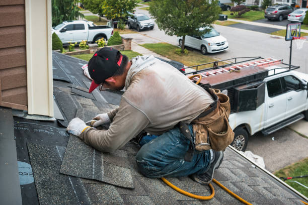 Professional Roofing technician working in Iola, TX